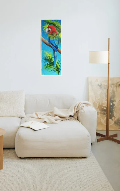 Room mock up showing the warm colours of the macaw parrot painting, beautifully brightening up a very neutral living room.