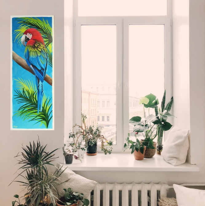 Room mock up showing the warm colours of the macaw parrot painting, beautifully brightening up a very neutral window area and fitting nicely on a narrow area of wall.