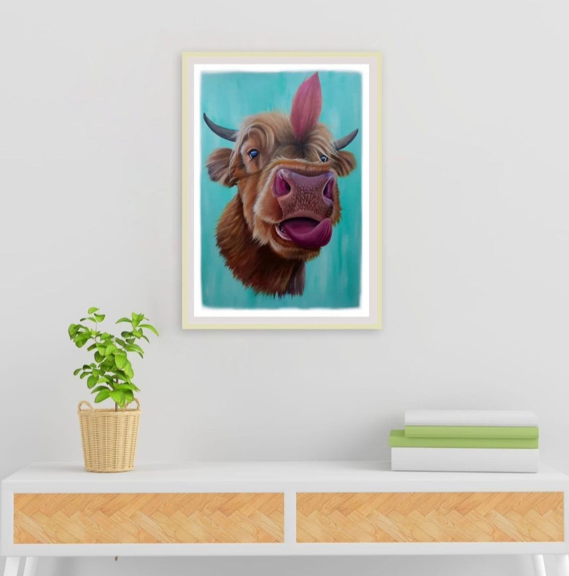 Room mock up showing the bold, modern colours of the Highland Cow print, brightening up a neutral console table.