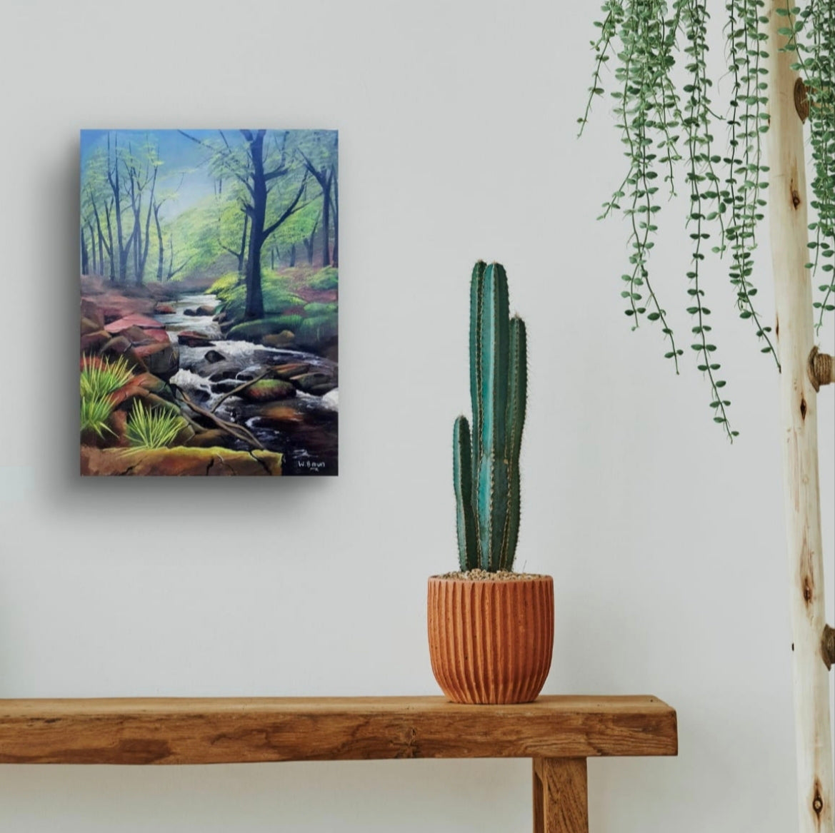 Room mock up showing the atmospheric river painting brightening up a console table