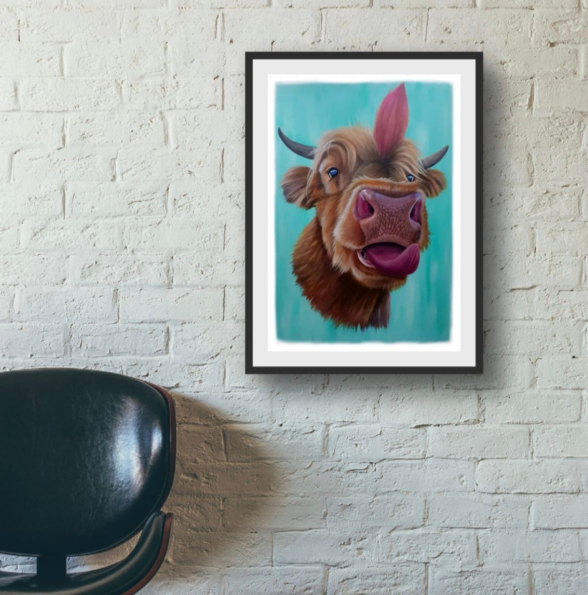 Room mock up showing the bold, modern colours of the Highland Cow print, brightening up a painted white wall.